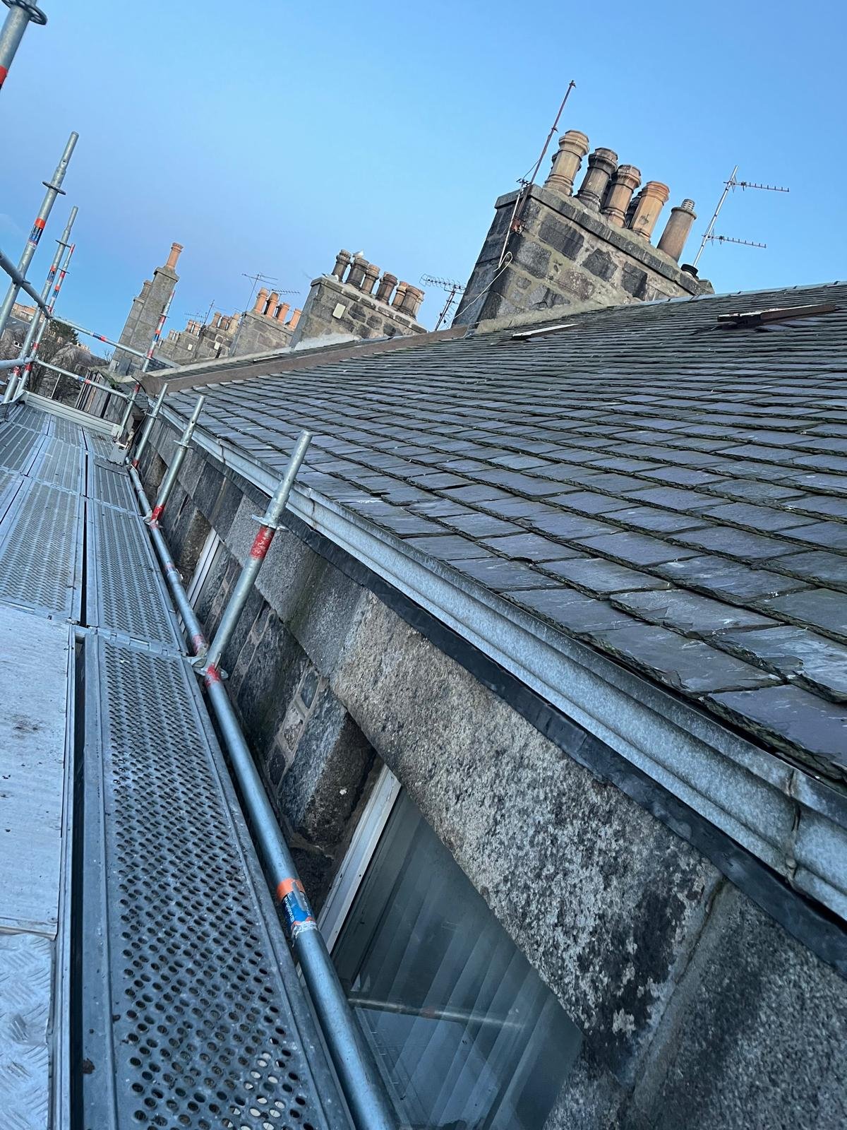 Roof Maintenance Group working on a traditional slate roof in Aberdeen